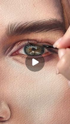 a woman's eye being drawn with colored pencils