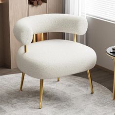 a white chair sitting on top of a rug