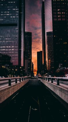 the city skyline is lit up at night