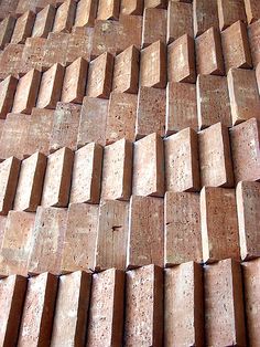 a wall made out of wooden blocks and bricks