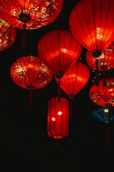 many red lanterns lit up in the dark