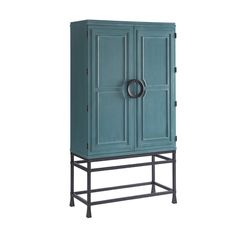 a blue cabinet sitting on top of a metal stand