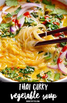 thai curry vegetable soup in a white bowl with chopsticks