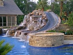 a pool with a waterfall next to it