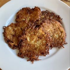 three fried food items on a white plate