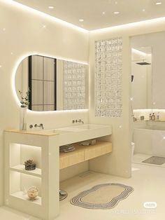 a white bathroom with two sinks and a large mirror above the sink is illuminated by lights