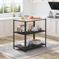 a kitchen island with food on it in front of a stove