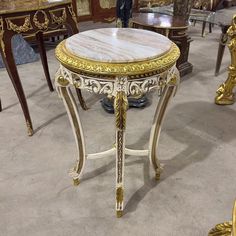 an ornately decorated table sits in the middle of a room