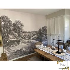 a room with a large mural on the wall