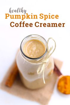 a jar filled with coffee creamer sitting on top of a table