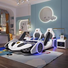 a bedroom with two beds and a car bed in the middle is lit up by blue lights