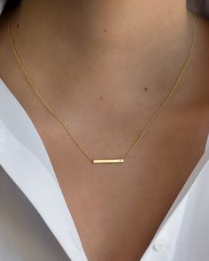 "14K solid gold Bar necklace with a tiny diamond , comes in the gold color of your choice, and length of your choice, dainty and absolutely amazing! The perfect everyday necklace, by itself or layered. made in L.A. Size: Approx. 1\" Diamond: 0.01 ct wt Ships in 5 to 7 business days Comes gift ready in our beautiful branded jewelry box." خواتم خطوبة, Jewelry Necklace Simple, Dainty Gold Jewelry, Minimalist Necklace Gold, Fancy Jewelry Necklace, Diamond Bar Necklace, Pretty Jewelry Necklaces, Gold Jewelry Simple Necklace, Gold Bar Necklace