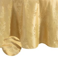 a gold table cloth with leaves on it