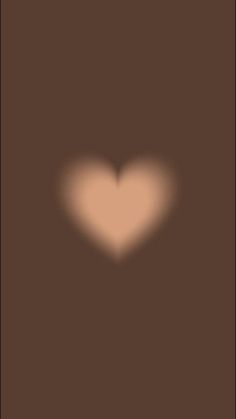 a brown suitcase with a heart shaped shadow on the front and back side, against a black background