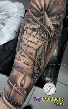 an arm with a bird and some writing on it