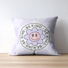 a pillow with a flower on it that says, be kind of beany brain