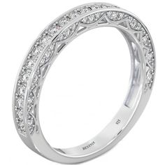 a diamond set wedding ring in white gold with an intricate design on the band and side stones