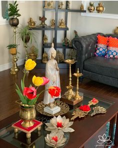 a living room filled with lots of furniture and flowers on top of a coffee table