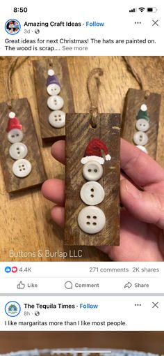 someone is holding up some christmas decorations made out of wood and paper with buttons on them