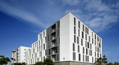 a large white building sitting on the side of a road