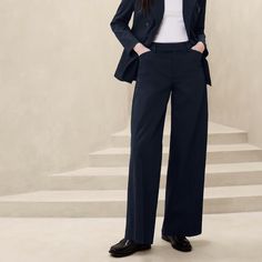 Brand New With Tags. Banana Republic Factory Stretch-Cotton Icon Trouser Size 8. Mid Rise. Full Length. Wide Leg. Icon Collection: The Icon Suit Collection Makes Sophistication Look Easy With Its Structured On-Trend Fit And Stretch Cotton Designed To Match Your Every Move. Wear Back With Our Best-Selling Icon Blazer, Now In Stretch Cotton. Full Length. Hook-And-Bar Closure With Zip Fly. Belt Loops. Welt Front And Back Pockets. Back Waist Darts. Trouser Crease. Made Exclusively For Banana Republic Factory. Fabric & Care 95% Cotton, 5% Elastane Spandex. Machine Wash. Imported. Color: Preppy Navy There Is A Mark On The Inside Label To Prevent Store Return. Measurements: Waist: 30 Inches Rise: Suit Collection, Icon Collection, Banana Republic Factory, Navy Color, Stretch Cotton, Fabric Care, Banana Republic, Pant Jumpsuit, Mid Rise