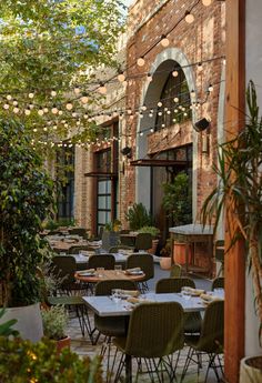 an outdoor dining area with tables and chairs