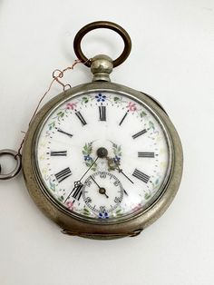 Antique mechanical ladies pocket watch, Enamel pocket watch, porcelain dial watch  Key winded pocket watch. Good condition, Working ! Diameter: 4.5 Silver Watches, Watch Pocket, Year Book, Pocket Watch Antique, Antique Watches, Sleepy Hollow, Pocket Watches, Pocket Watch, Jewelry Watches