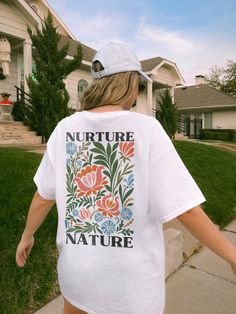 ✺ NURTURE NATURE - WILDFLOWER GRAPHIC TEE ✺ * Q U I C K F A C T S * This design is a unique, one-of-a-kind awesome illustration that has been created in house. ✺ 100% Cotton (fiber content may vary for different colors) ✺ Classic fit ✺ Sizing is unisex so runs like men's, though not overly large ✺ Most women find their typical size works best, since they are meant to fit a touch loose This is a Unisex T-Shirt which you can use as an Oversize T-Shirt Dress, please check the dimensions to make sur Mother Nature Tshirt, Graphic Tee Photography, White Graphic Print Shirt For Spring, Spring White Letter Print Shirt, White Floral Print T-shirt Relaxed Fit, White Floral Print Relaxed Fit T-shirt, White Botanical Screen Print Tops, White T-shirt With Botanical Print, White Botanical T-shirt With Floral Print