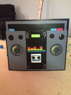 an old school boombox made out of cardboard