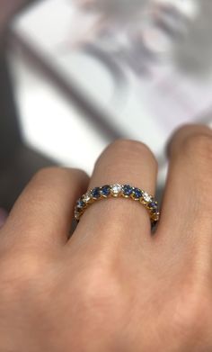 a woman's hand with a ring on it