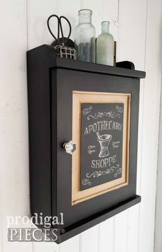 a chalkboard sign mounted to the side of a wall next to a bottle opener