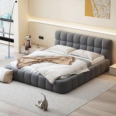 a large bed sitting on top of a wooden floor