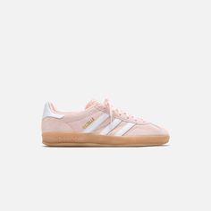 Women's Gazelle Indoor silhouette Suede upper Padded collar T-toe detail Textured tongue  Tri-Stripes on lateral sides  Gazelle gold foil branding on lateral sides  Flat woven laces Leather heel counter Gum rubber outsole   Style: aaih5484 Color: Sandy Pink / White / Gum 3 Material: Leather Light Pink Adidas Gazelle, Back To School Shoes Adidas, Adidas Shoes Women Pink, Light Pink Adidas Campus, Light Pink Sambas, Cute Popular Shoes, Pink And White Sambas, Gazzels Shoes, Colored Sambas