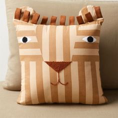 a pillow that has been made to look like a dog's face on it