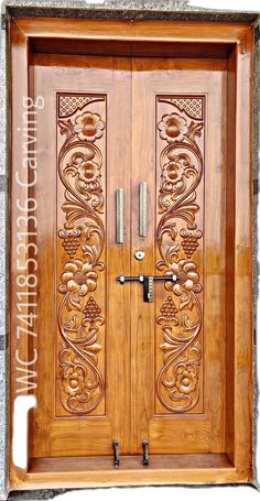 an ornate wooden door with metal handles on the front and side doors are decorated with intricate carvings