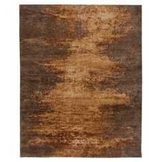 an area rug with brown and tan tones