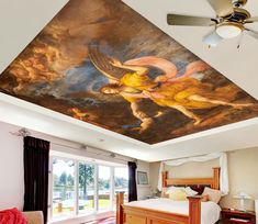 a bedroom with a ceiling painted like an angel