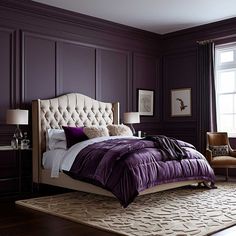 a bedroom with purple walls and a white bed in front of a large window,