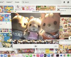 two small stuffed animals sitting next to each other in front of a computer screen with pictures on it