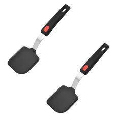 two black and white spatulas with red handles