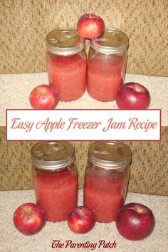 four jars filled with apples sitting on top of a carpet