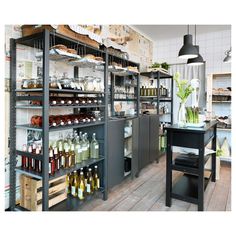 a store with shelves filled with lots of different types of items and bottles on them