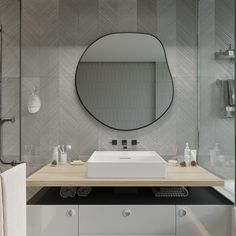 a bathroom with a sink, mirror and towel on the counter in front of it