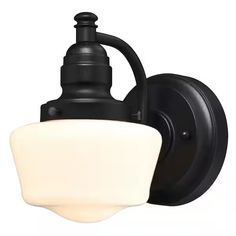 a black wall light with a white glass shade