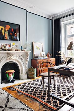 a living room filled with furniture and a fire place