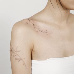 a woman with a tattoo on her shoulder