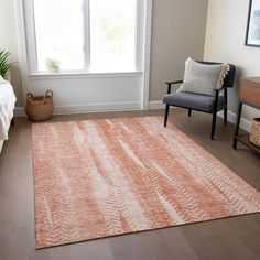 a living room with a chair, rug and window