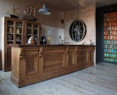 an old fashioned bar with bookshelves in the background