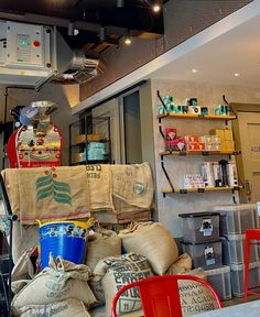 a room filled with lots of different types of bags and containers on top of each other