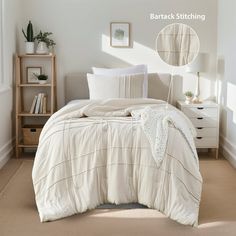 a white bed sitting in a bedroom next to a dresser and window on top of a carpeted floor